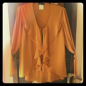 Ruffle zip front top